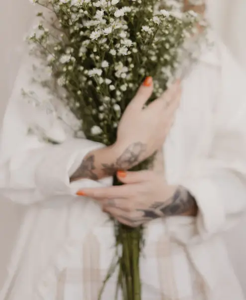 Sample image: a florist holding a fresh white bouquet